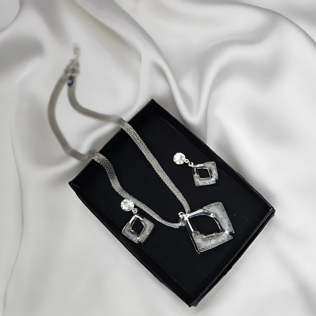 A Silver Modren Necklace and Earrings with White Crystals
