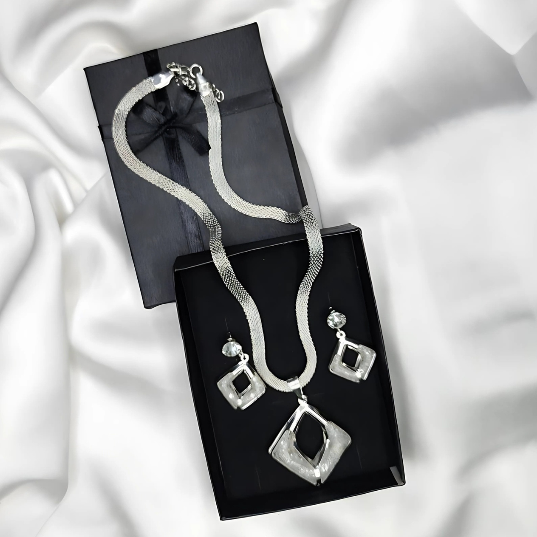 A Silver Modren Necklace and Earrings with White Crystals