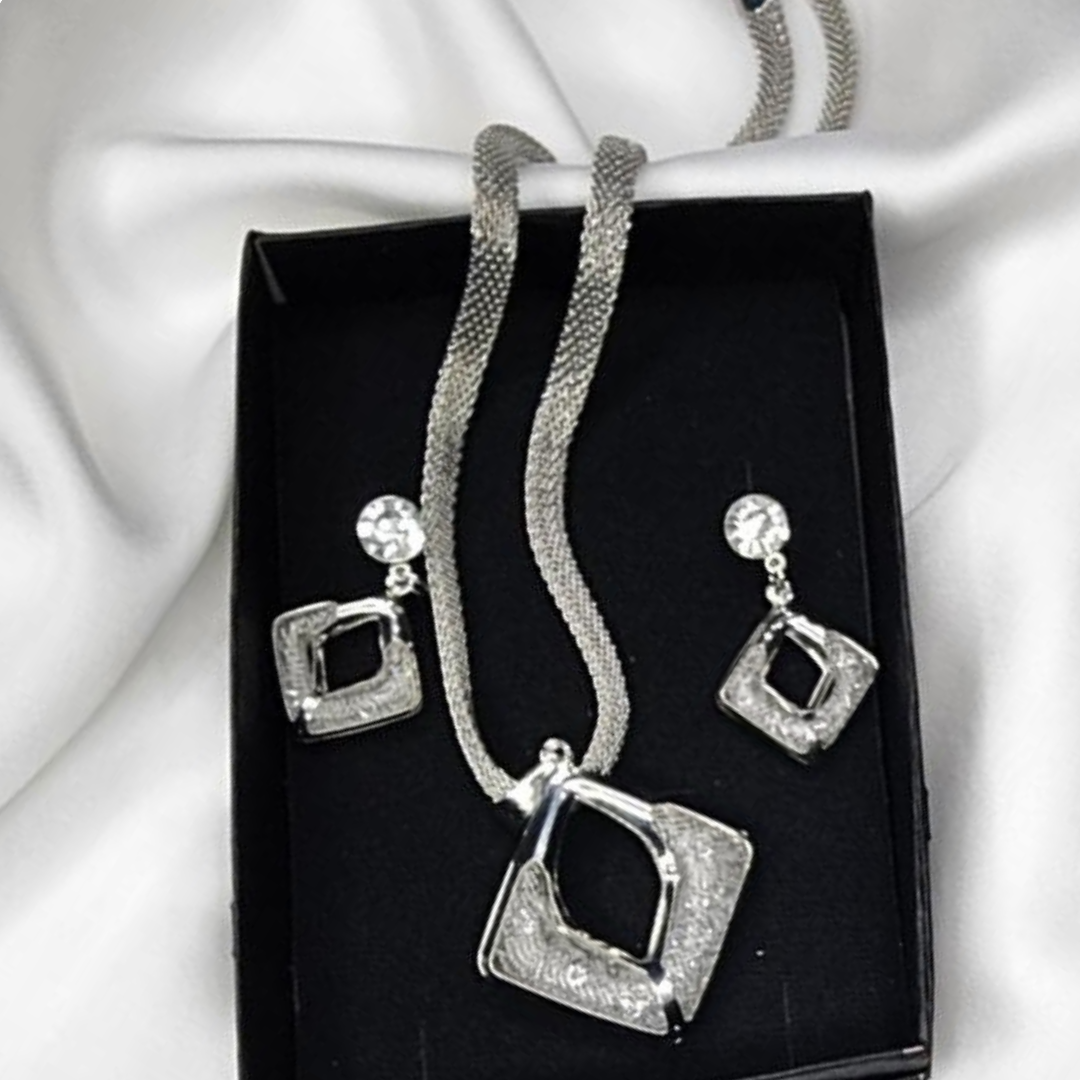 A Silver Modren Necklace and Earrings with White Crystals